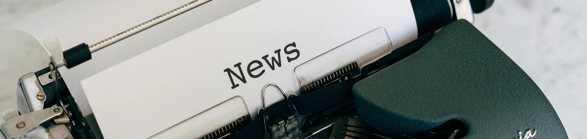 type writer with the title news at the top