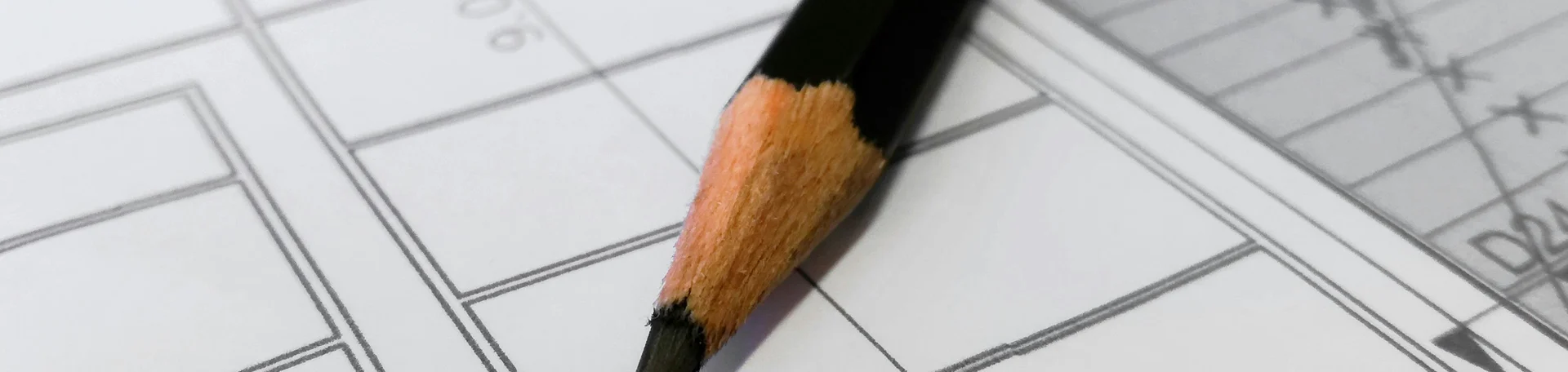 pencil laying on building schematics